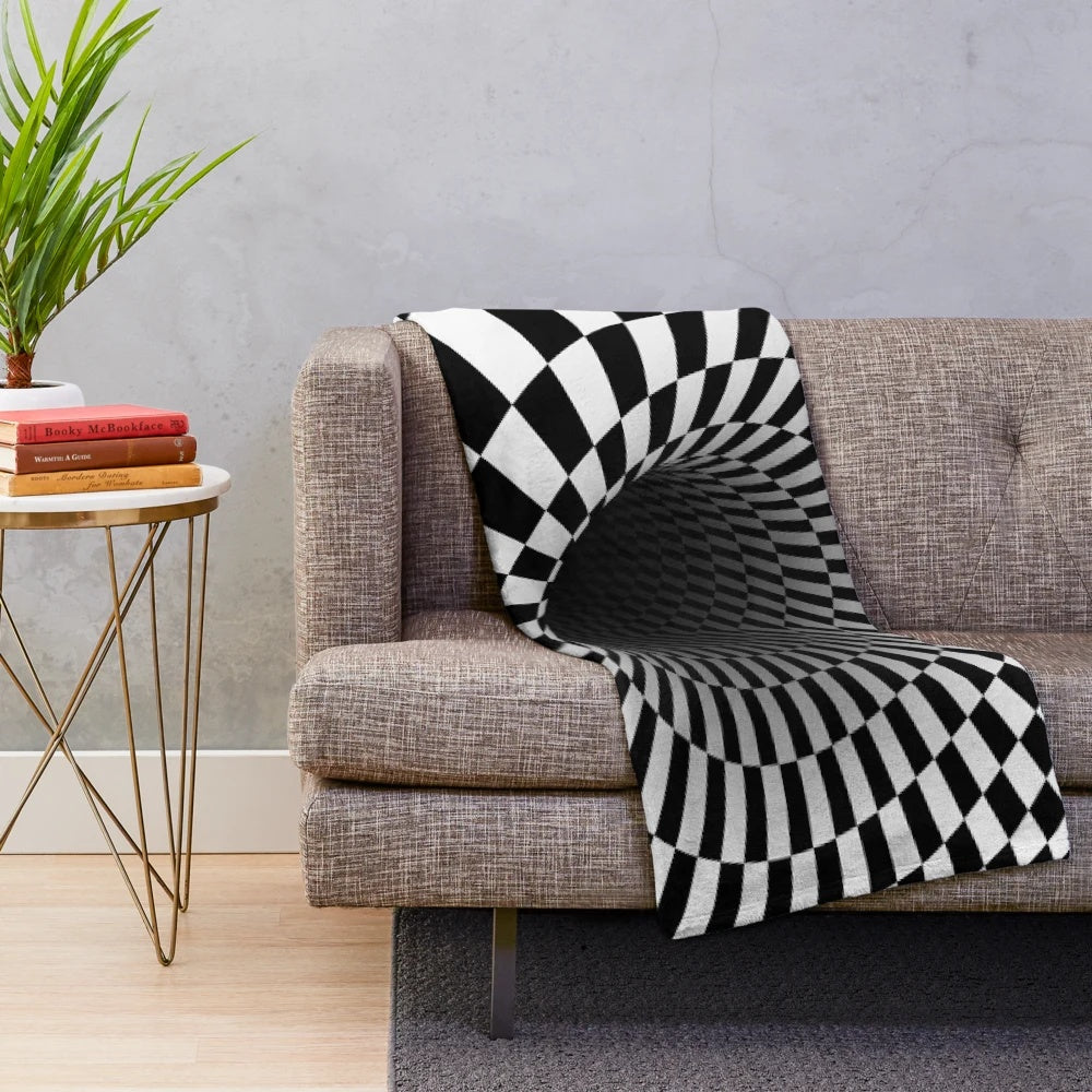 Black and white optical illusion plush blanket with a hypnotic checkered pattern