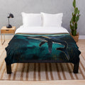Whales swimming under the moonlight on a plush, cozy blanket