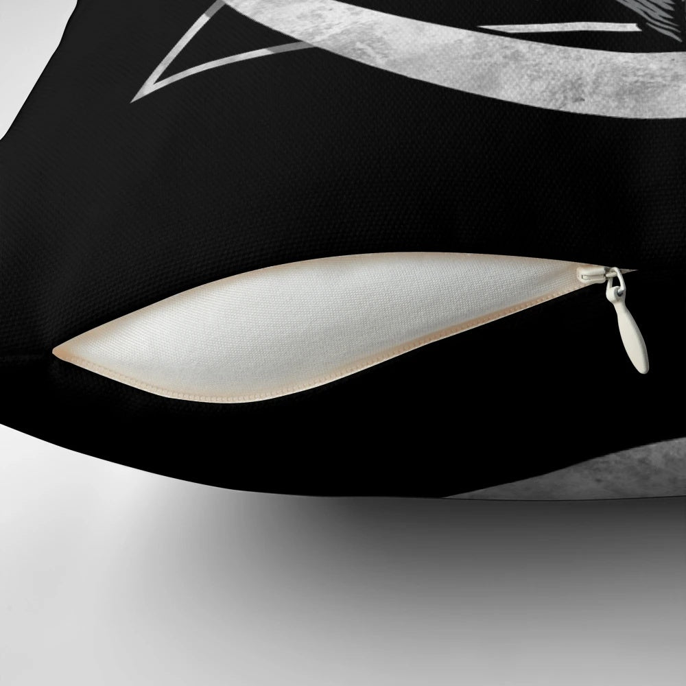 Black and white geometric bat pillow with moon and moth design