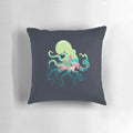 A decorative ocean-themed pillow featuring abstract mermaid and octopus designs in a negative space style.