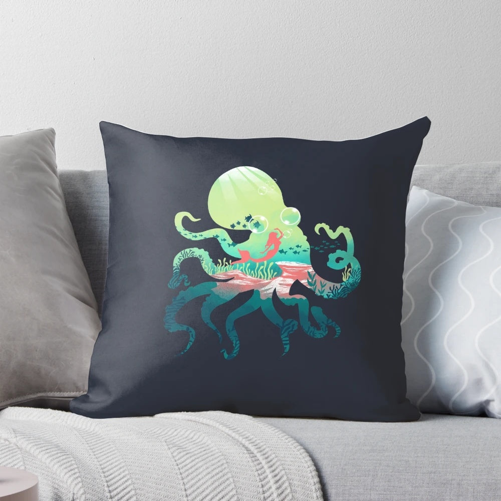 A decorative ocean-themed pillow featuring abstract mermaid and octopus designs in a negative space style.