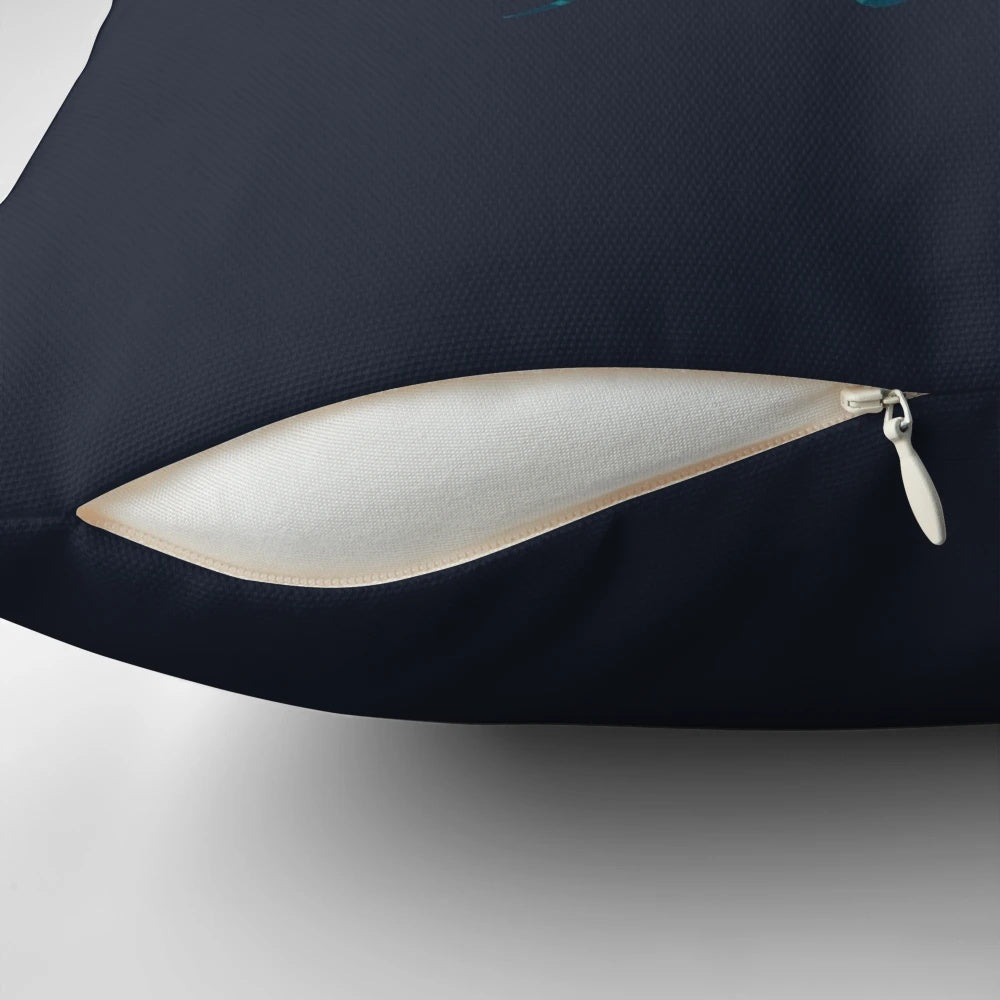 A decorative ocean-themed pillow featuring abstract mermaid and octopus designs in a negative space style.
