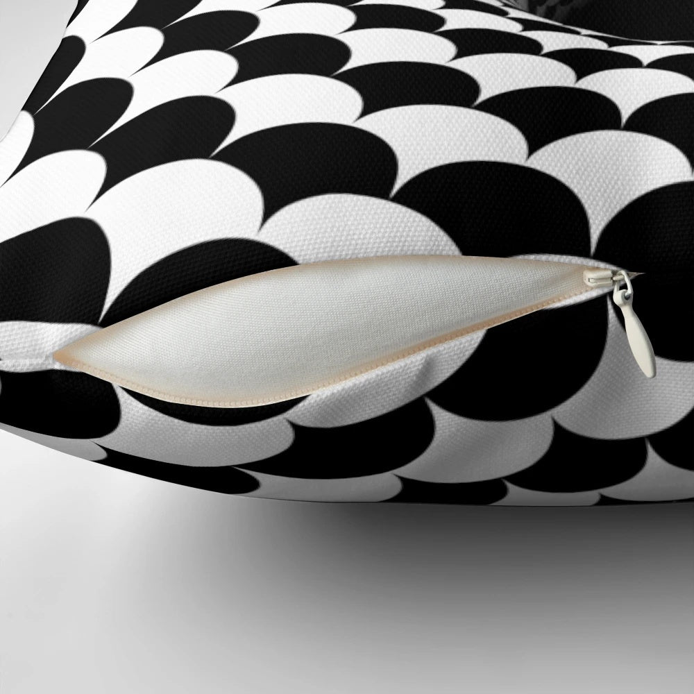 Optical illusion pillow featuring a hypnotic black and white design resembling a wormhole or portal