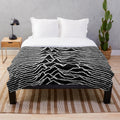 Plush blanket featuring the iconic "Unknown Pleasures" album cover design