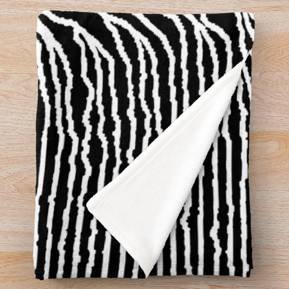 Plush blanket featuring the iconic "Unknown Pleasures" album cover design