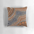 Decorative pillow with a mandala-inspired pattern of colorful points and blossoms