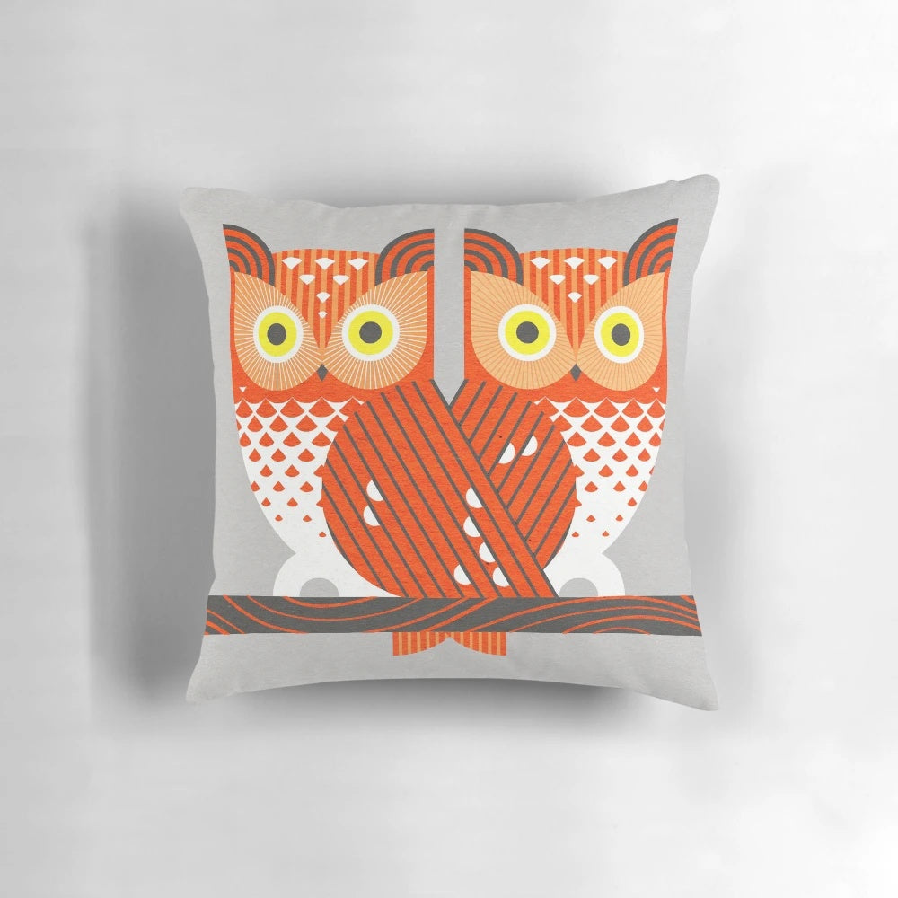 Screech owl digital illustration in a geometric, minimalist design on a decorative pillow.