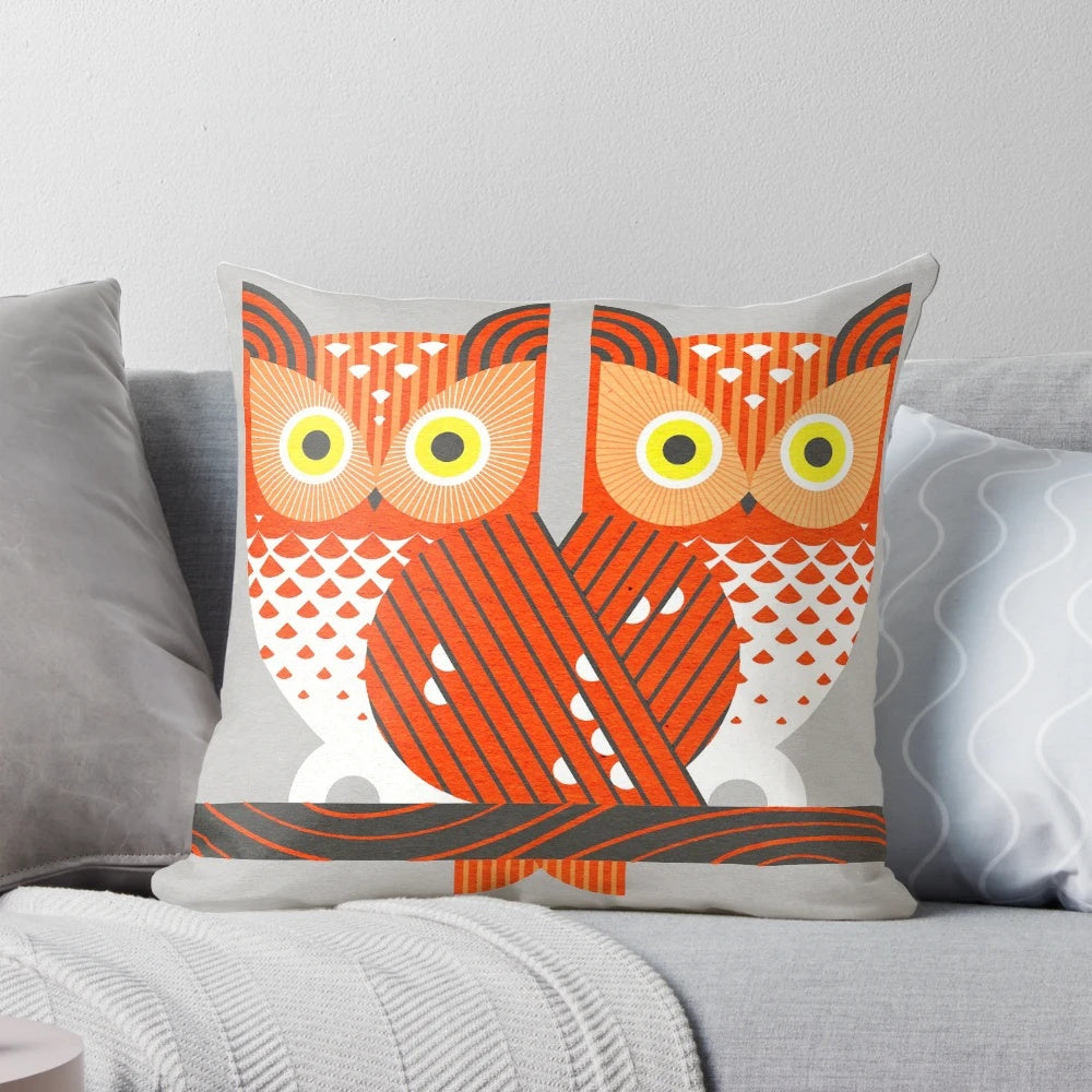 Screech owl digital illustration in a geometric, minimalist design on a decorative pillow.