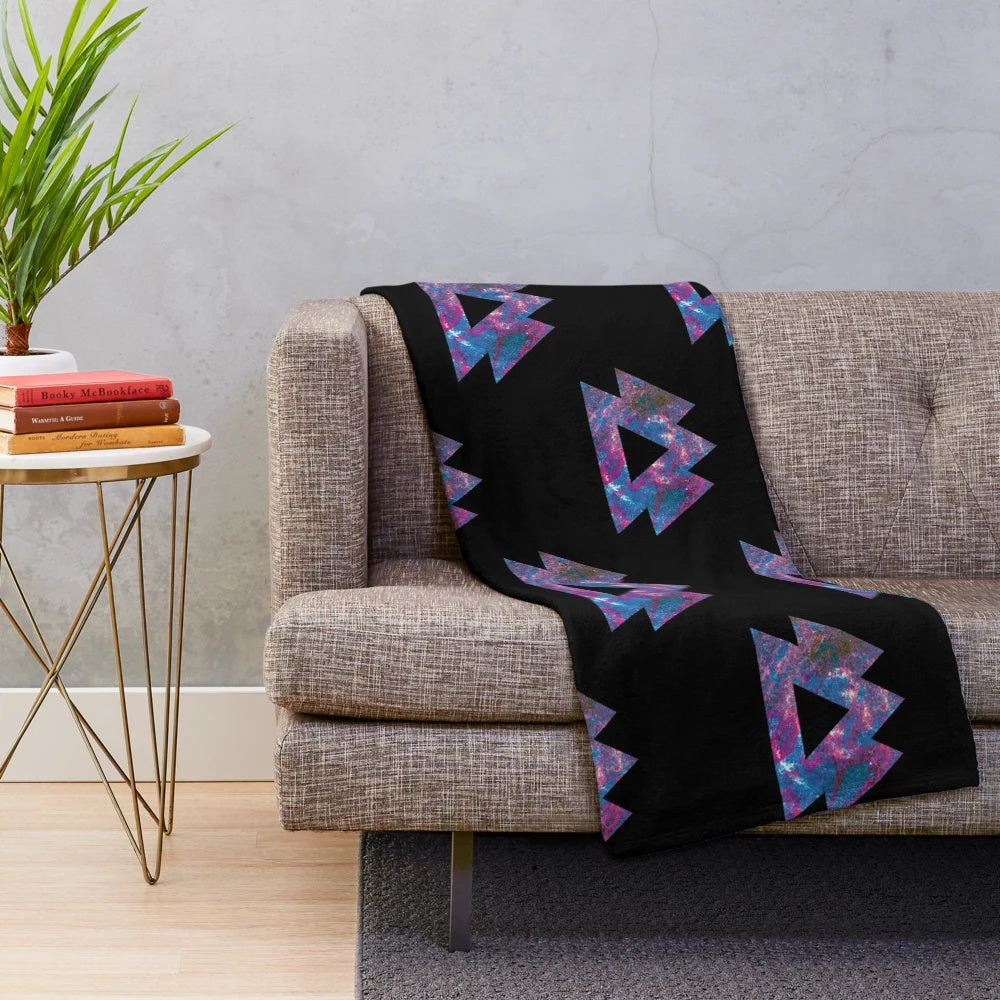 Trippy plush blanket with psychedelic, geometric, and galaxy-inspired design