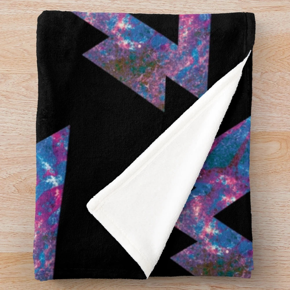 Trippy plush blanket with psychedelic, geometric, and galaxy-inspired design