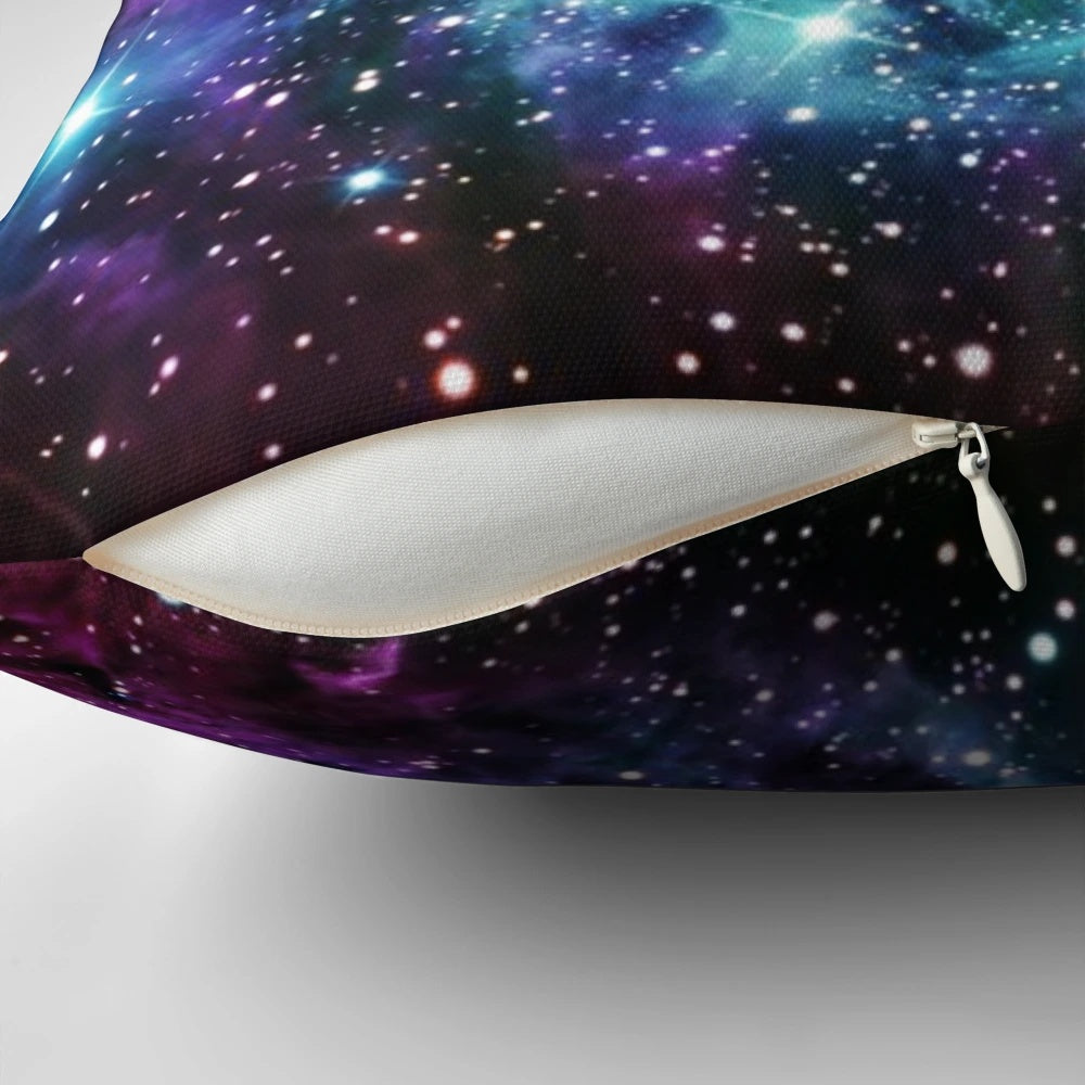 Turquoise, teal, and purple nebula-inspired pillow with a cosmic, galaxy-like design