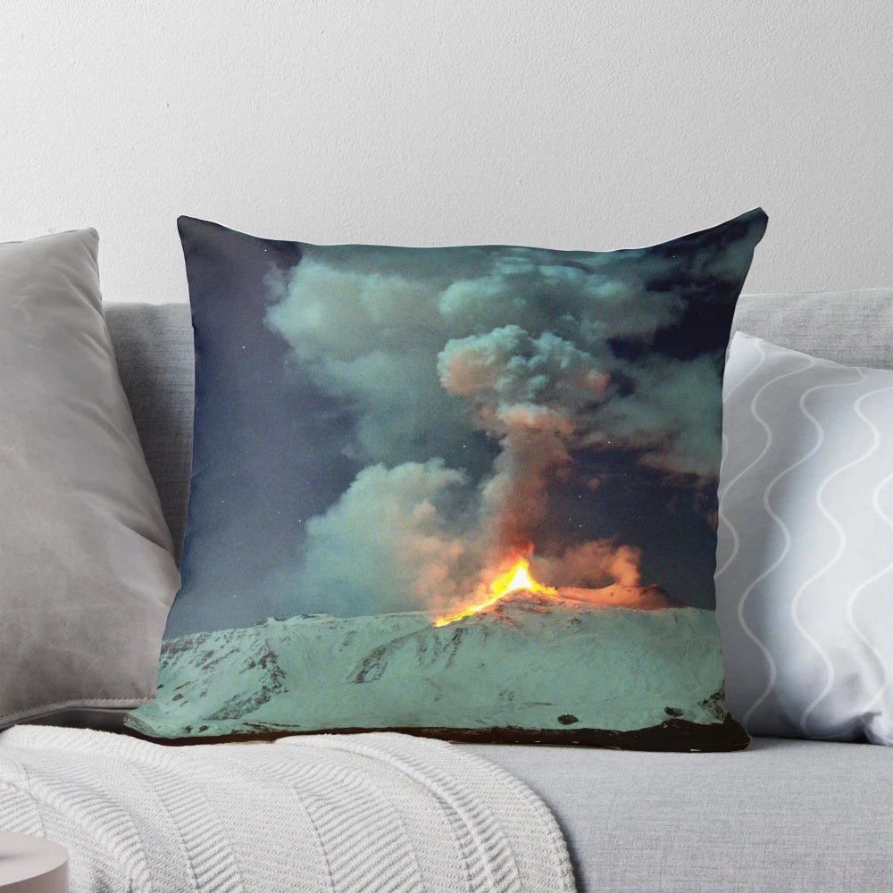 Pillow featuring a breathtaking image of a volcanic eruption at night, with lava fountains and a plume of smoke against a starry sky.