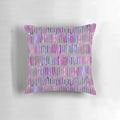 Messy watercolor stripes in pink and purple on a throw pillow