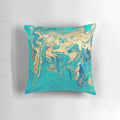 Vibrant blue, gold, and teal fluid painting design on a square throw pillow