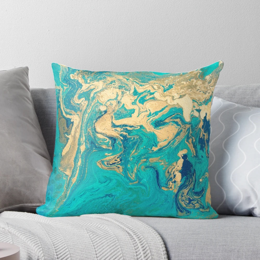 Vibrant blue, gold, and teal fluid painting design on a square throw pillow
