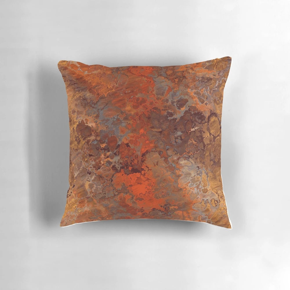 Decorative abstract throw pillow with metallic gold and rust accents