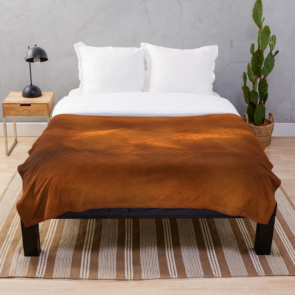 Orange copper plush blanket with metallic sheen