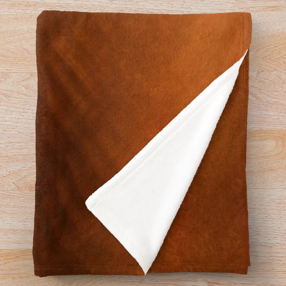 Orange copper plush blanket with metallic sheen