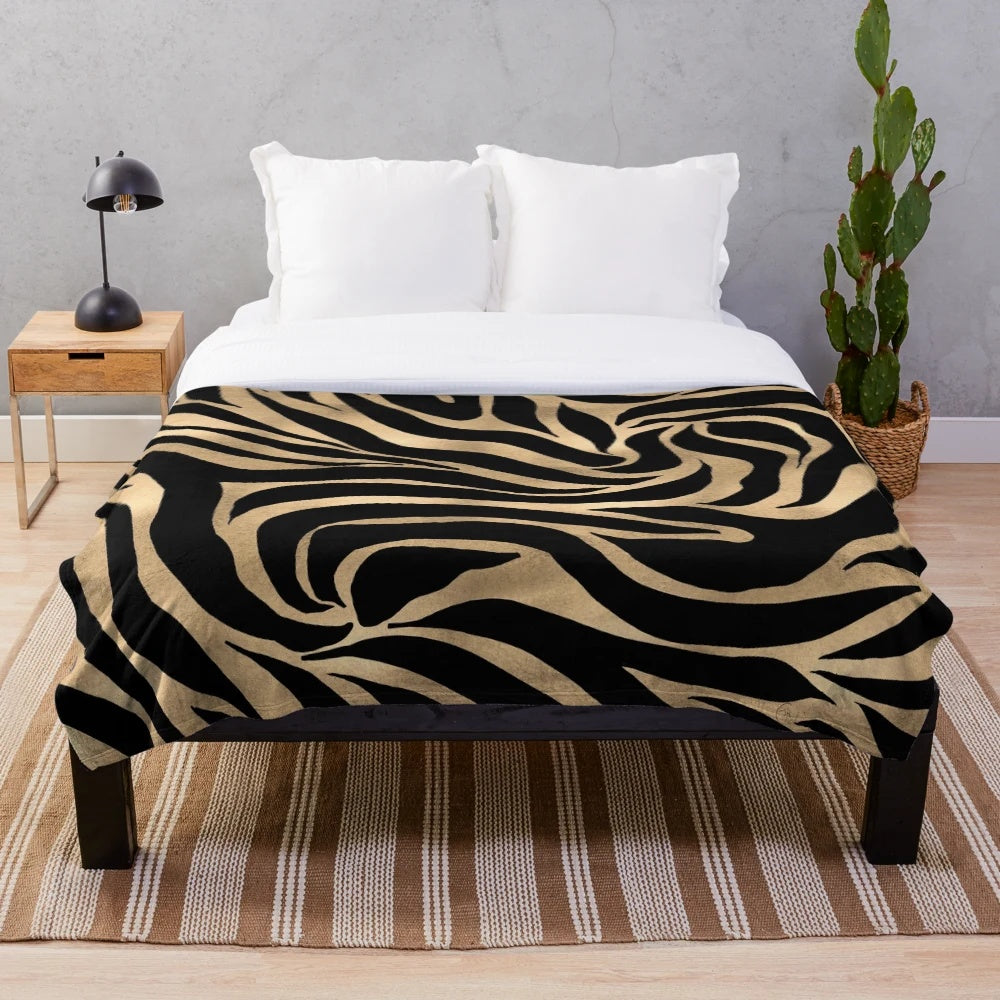 Metallic gold zebra print plush blanket with abstract art design
