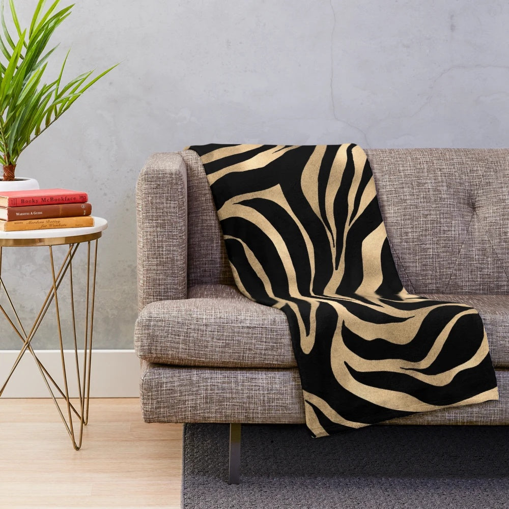 Metallic gold zebra print plush blanket with abstract art design