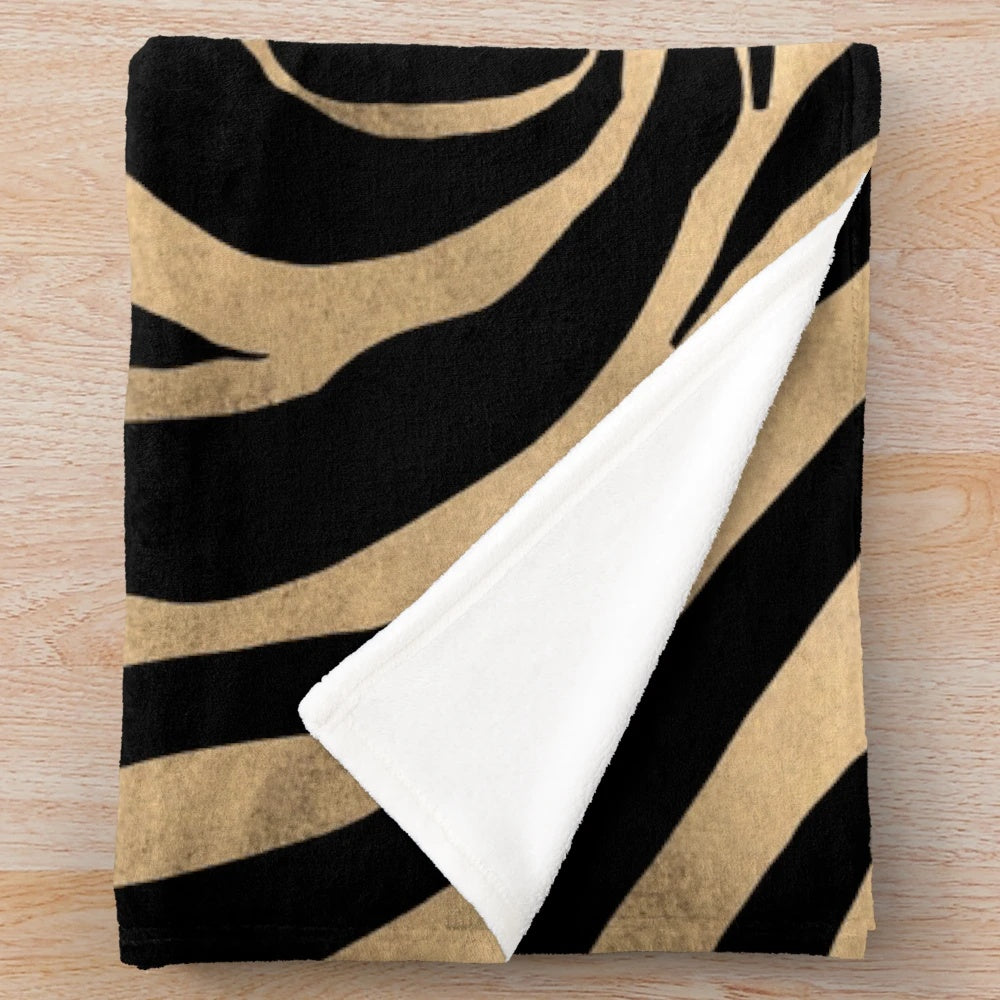 Metallic gold zebra print plush blanket with abstract art design