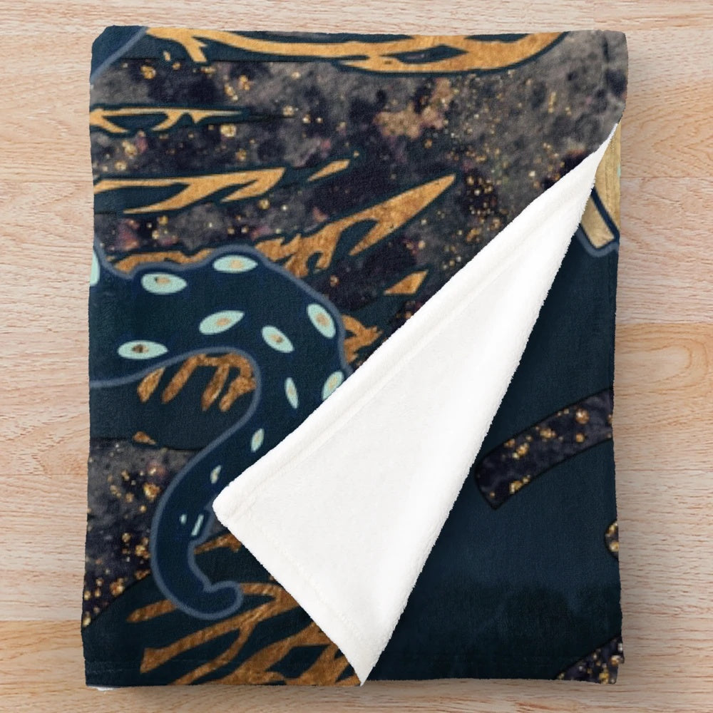 Metallic octopus plush blanket with abstract sea creature design