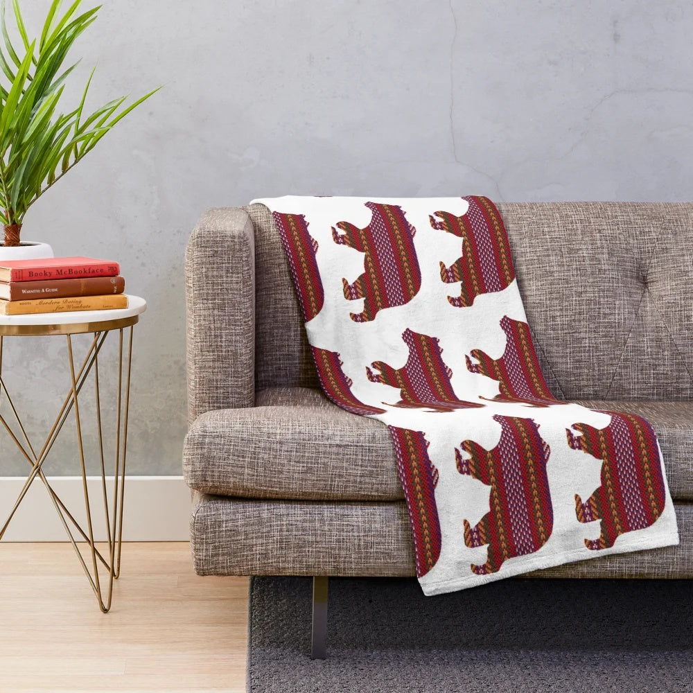 Metis-inspired plush blanket with bear and sash design, celebrating indigenous Canadian culture