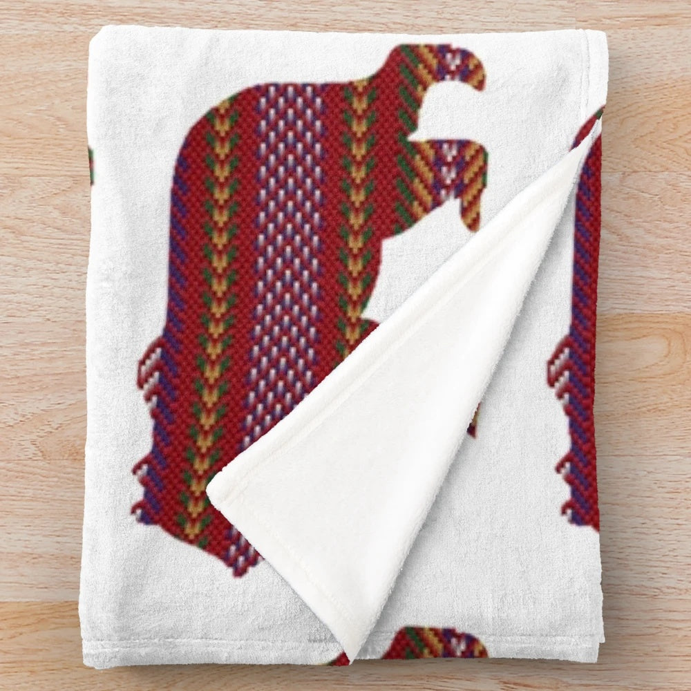 Metis-inspired plush blanket with bear and sash design, celebrating indigenous Canadian culture