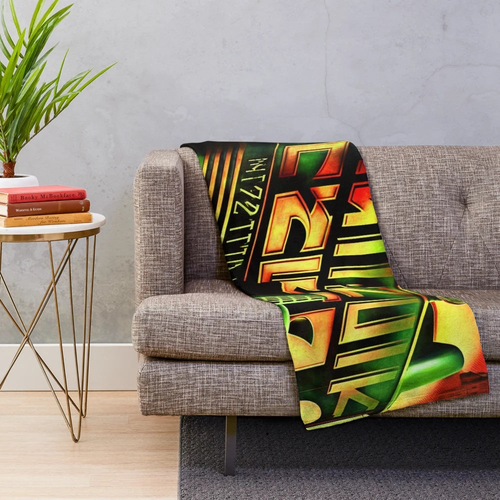 Plush blanket featuring a Metropolis-inspired futuristic cinema design with green, red, black, and yellow lights