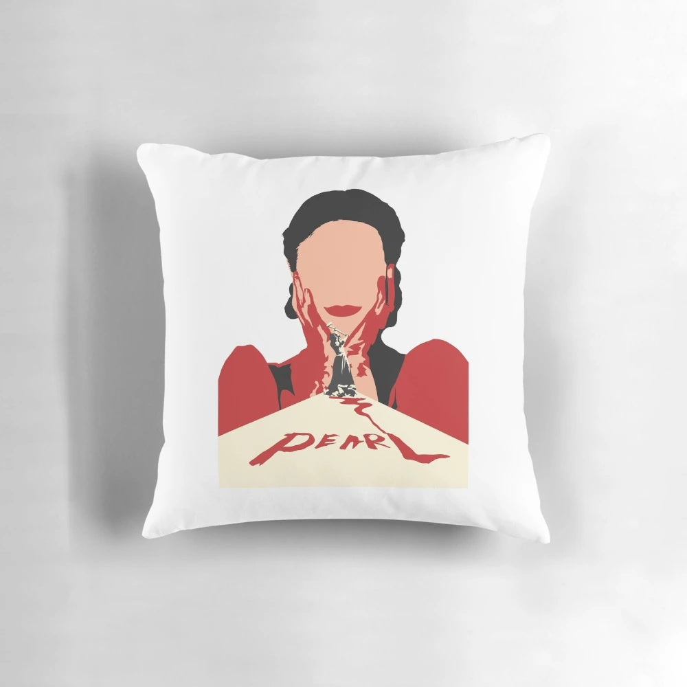 A decorative pillow featuring a close-up image of Mia Goth's character "Pearl" from the horror movie, with a bloody smile.