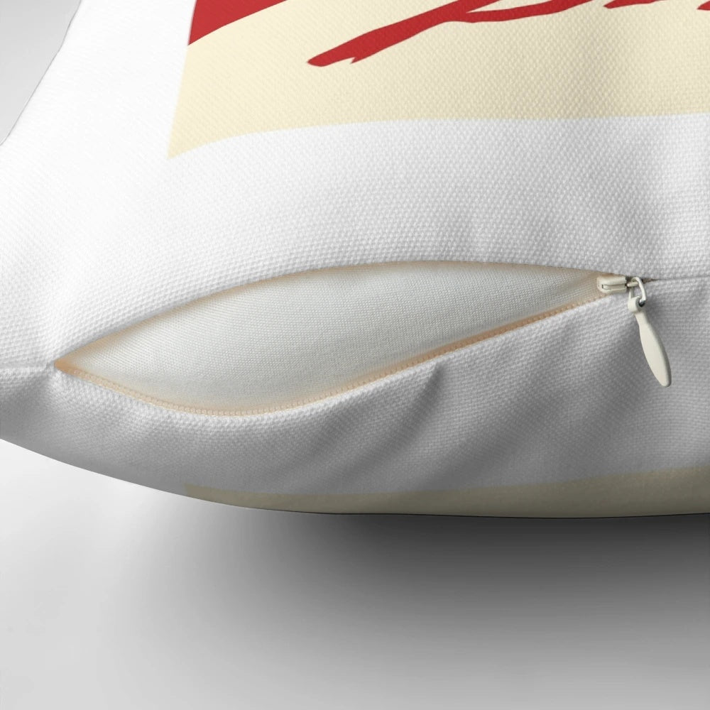 A decorative pillow featuring a close-up image of Mia Goth's character "Pearl" from the horror movie, with a bloody smile.