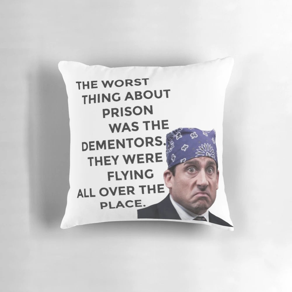 A decorative throw pillow featuring the character Prison Mike from the TV show The Office, played by actor Steve Carell.
