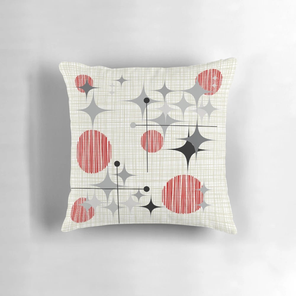 Eames era starburst and globe pattern pillow in a retro atomic inspired design