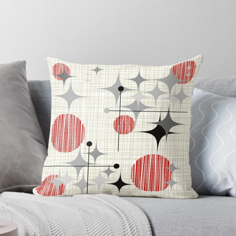 Eames era starburst and globe pattern pillow in a retro atomic inspired design