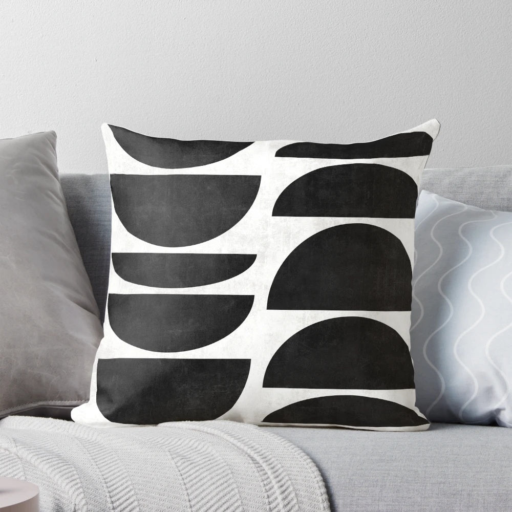 Mid-century modern black and white concrete pillow with a unique circle pattern.