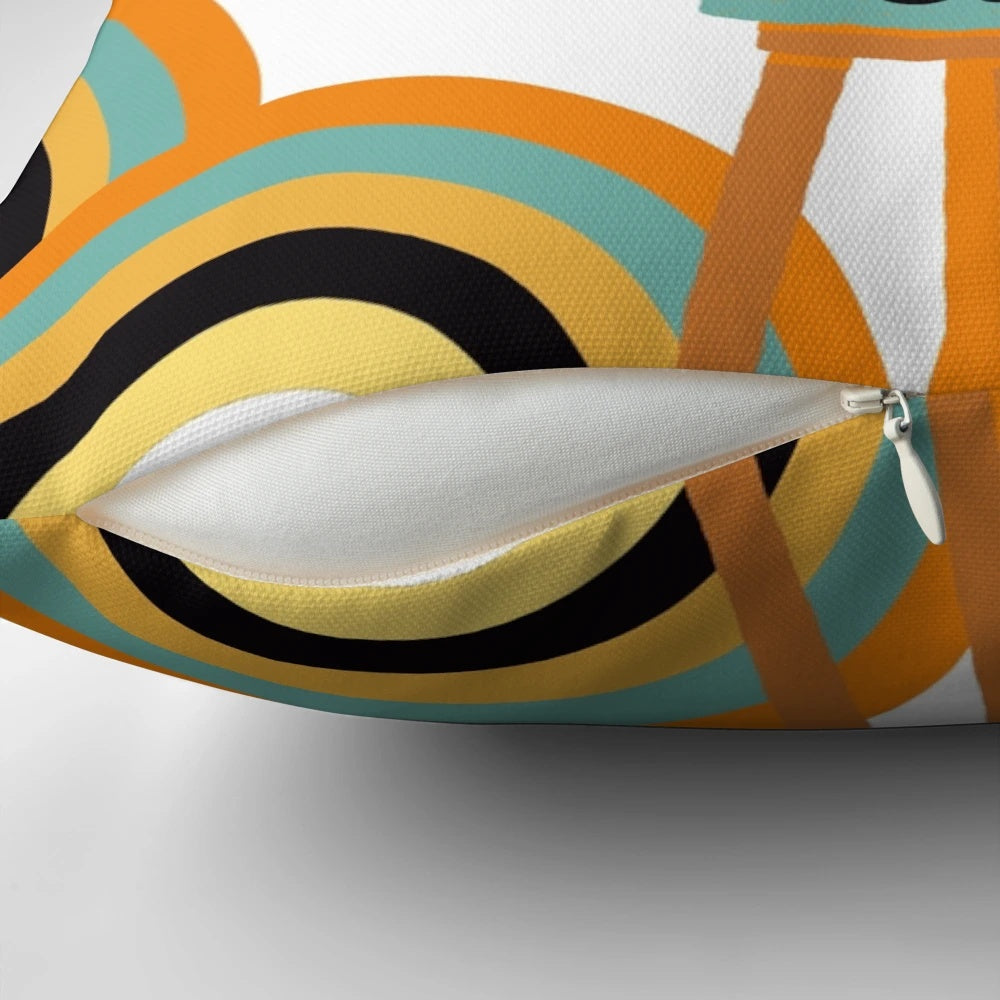 A black cat sitting among a variety of retro-styled shapes and patterns on a mid-century modern-inspired throw pillow.