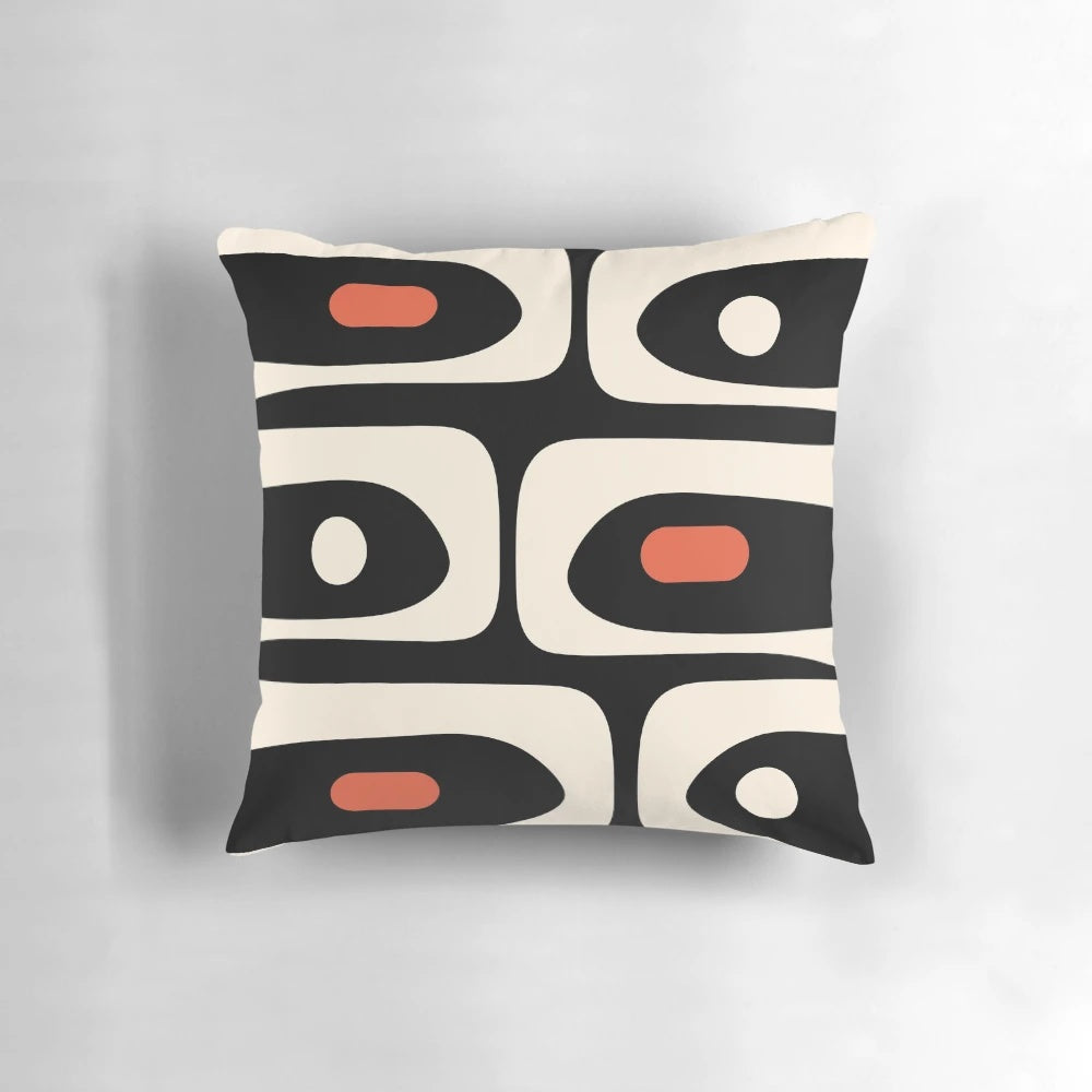 Midcentury modern abstract pattern throw pillow in bold black, orange, and almond cream colors