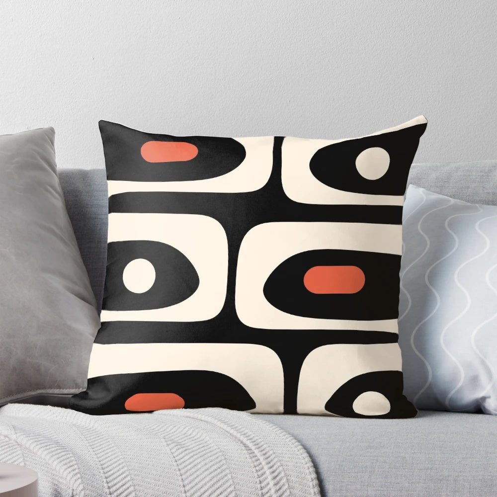Midcentury modern abstract pattern throw pillow in bold black, orange, and almond cream colors