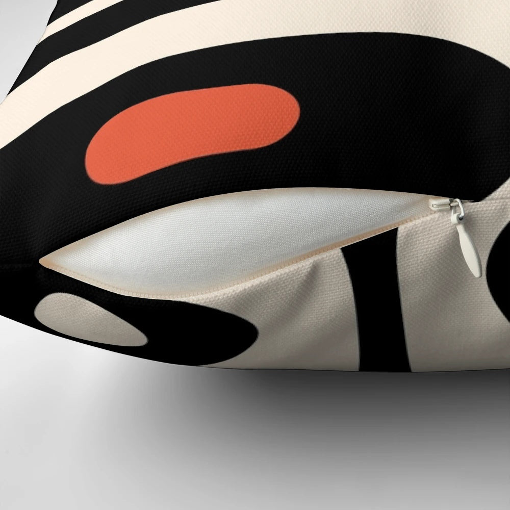 Midcentury modern abstract pattern throw pillow in bold black, orange, and almond cream colors
