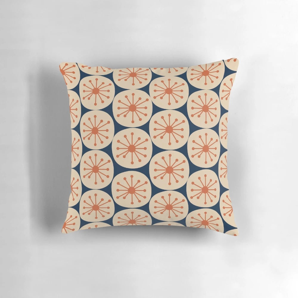 Midcentury modern pillow with retro atomic dots pattern in burnt orange, beige, and navy blue