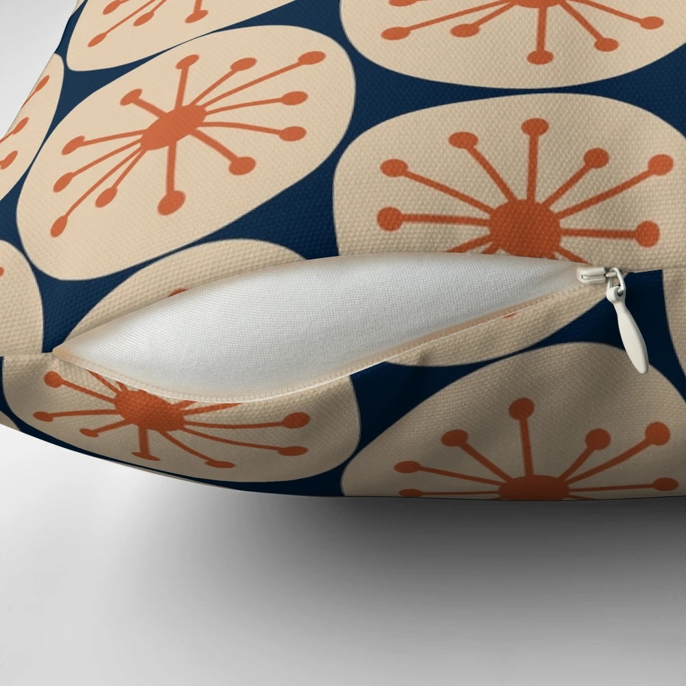 Midcentury modern pillow with retro atomic dots pattern in burnt orange, beige, and navy blue