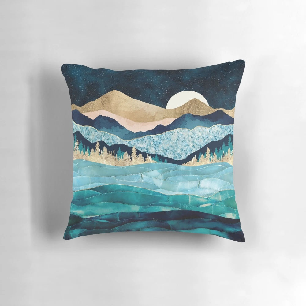 Midnight Ocean Pillow - Plush, decorative pillow featuring a celestial-inspired design with moons, stars, and mountains in shades of indigo, gold, and pink.