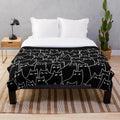 Plush blanket featuring a minimal black and white cat pattern design