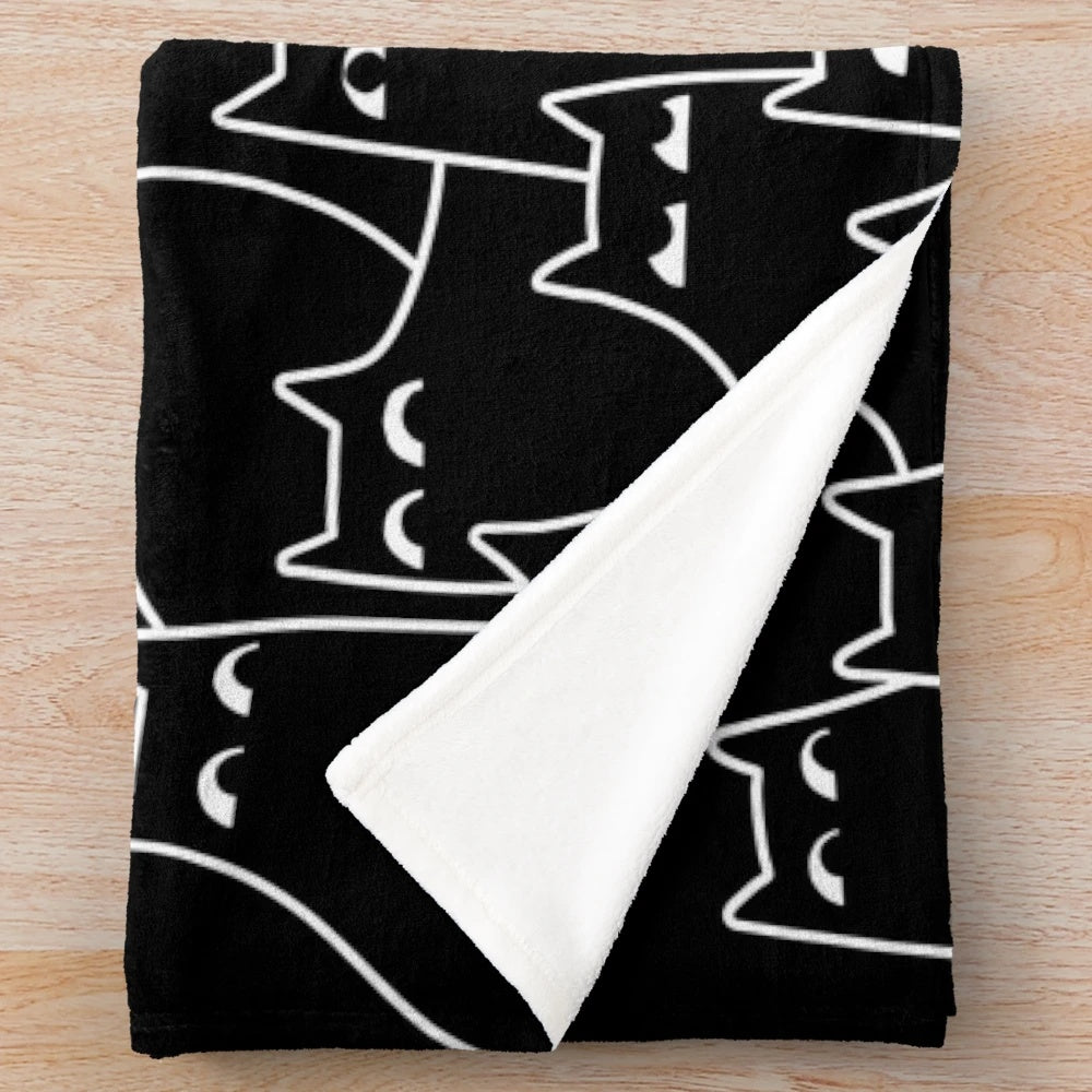 Plush blanket featuring a minimal black and white cat pattern design