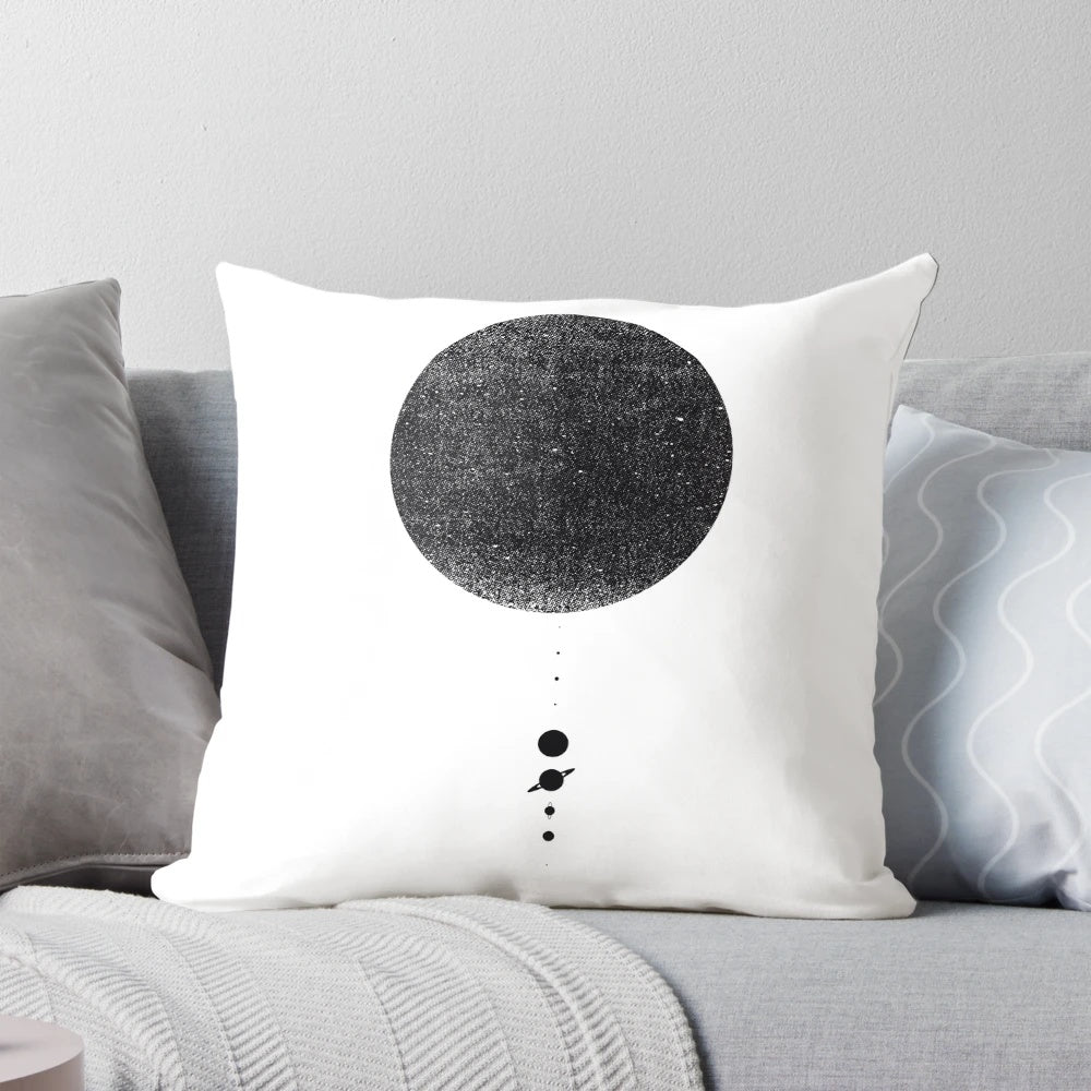 Minimal black and white solar system pillow with planets and celestial elements for home decor.