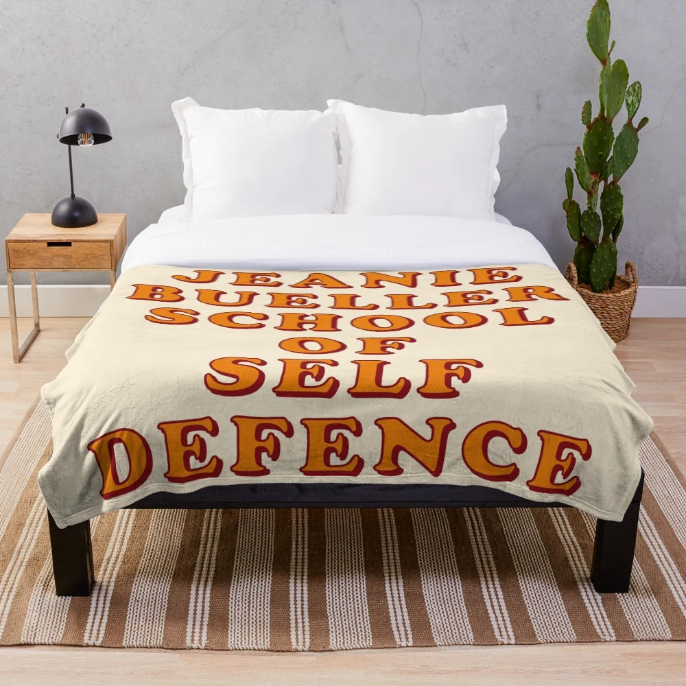 Plush blanket featuring a minimalist design of the "Jeanie Bueller School of Self-Defence" quote from the 1980s movie Ferris Bueller's Day Off.