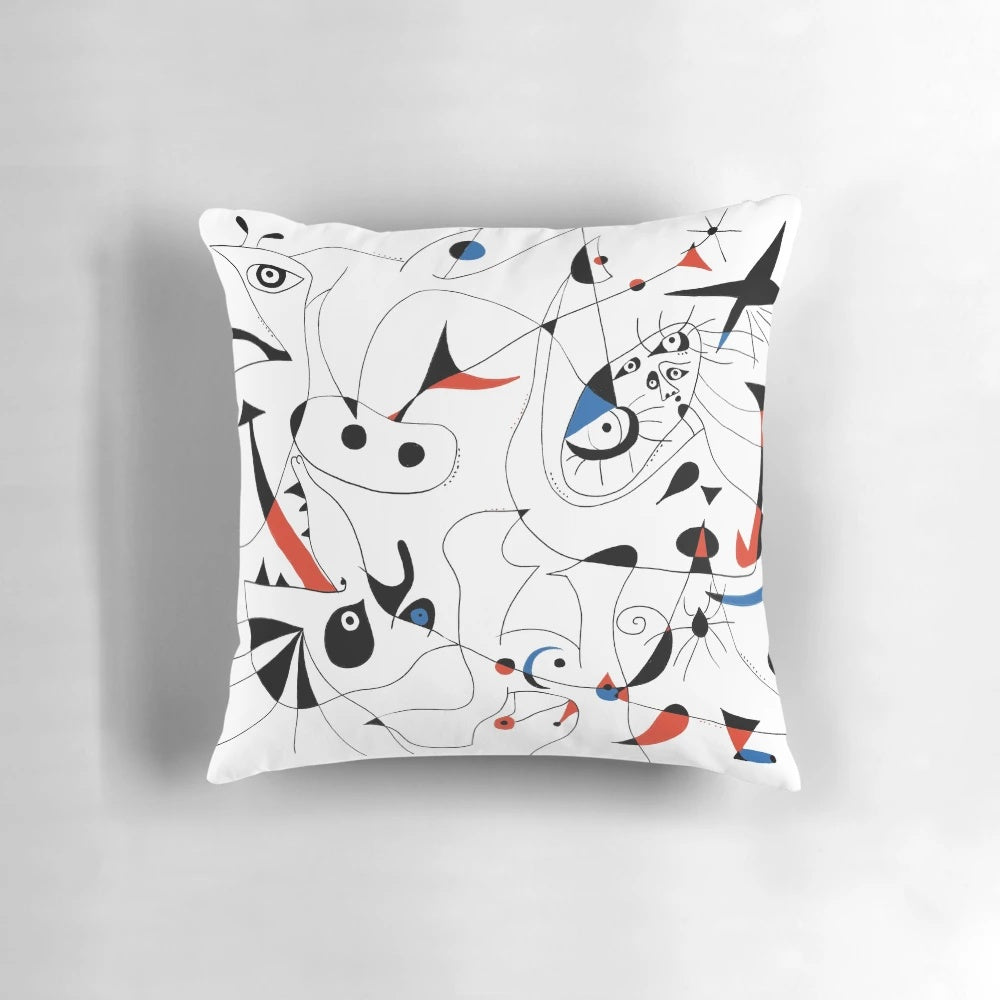 Minimalist abstract art pillow with black lines and shapes, inspired by the artwork of famous 20th century painter Joan Miró.