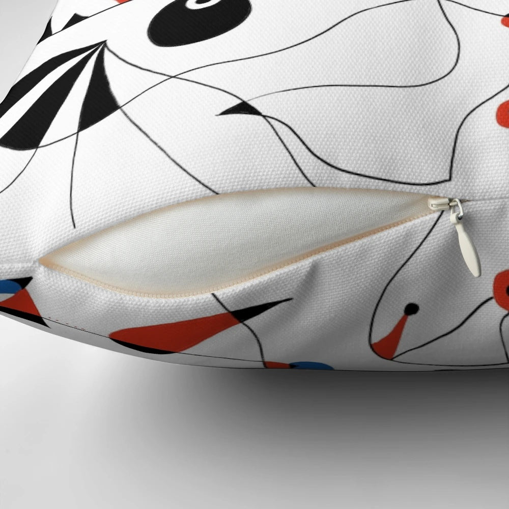 Minimalist abstract art pillow with black lines and shapes, inspired by the artwork of famous 20th century painter Joan Miró.