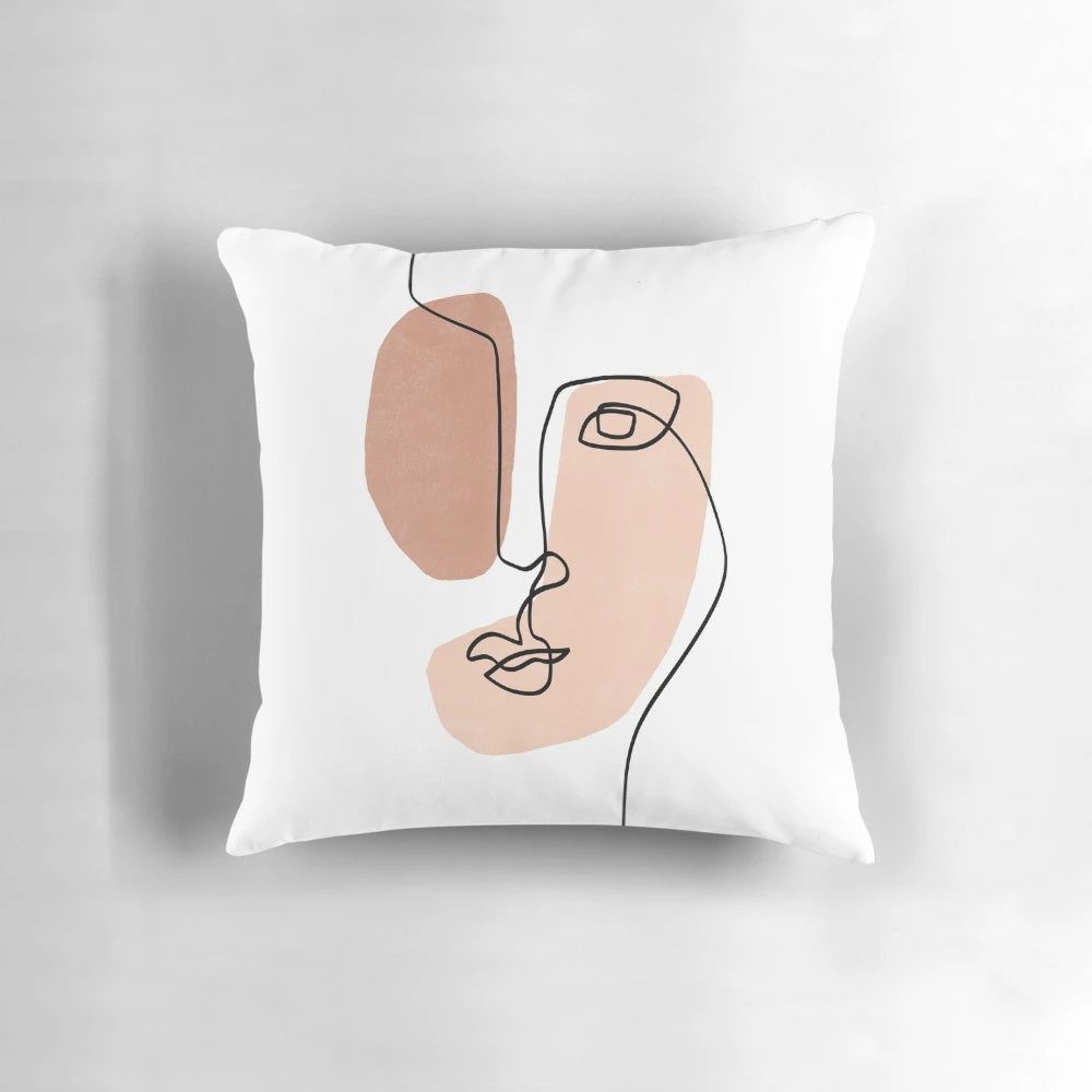 Minimalist abstract face design printed on a decorative throw pillow