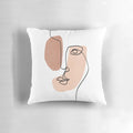 Minimalist abstract face design printed on a decorative throw pillow